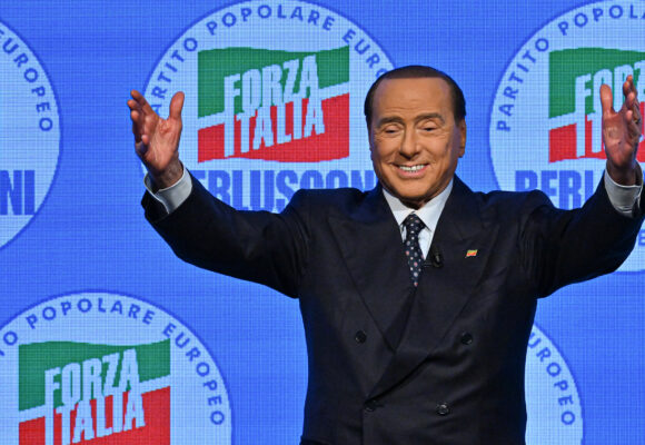 Silvio Berlusconi acknowledges applause on stage on September 23, 2022 at the Manzoni theater in Milan during a meeting closing his party's campaign.