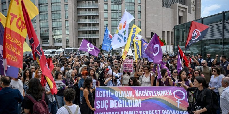 People gather outside Istanbul's courthouse behind a banner reading "Being LGBT+ and organising are not a crime. Turkish police arrested dozens of people on September 13 in gay bars and at the homes of LGBTQ activists on charges including "obscenity", "assisting prostitution" and having "financial links abroad". Authorities have blocked social media accounts belonging to human rights defenders and media outlets as part of operations dubbed "My Family Is Safe."